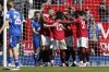 Manchester United's Anthony Martial celebrates with his teammates after scoring his side's second goal during the English Premier League soccer match between Manchester United and Everton, at the Old Trafford stadium in Manchester, England, Saturday, April 8, 2023. (AP Photo/Dave Thompson)