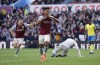 Aston Villa's Ollie Watkins celebrates scoring against Nottingham Forest during the English Premier League soccer match at Villa Park, Birmingham, England, Saturday April 8, 2023. (Joe Giddens/PA via AP)