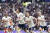 Tottenham Hotspur's Son Heung-min, second left, celebrates scoring their side's first goal of the game, his hundredth Premier League goal, during the Premier League match between Tottenham and Brighton & Hove Albion at the Tottenham Hotspur Stadium, London. , Saturday April 8, 2023. (Zac Goodwin/PA via AP)