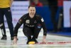 Canadian skip Brad Gushue smiles as his shot enters the house during fifth end action against Team Sweden in the qualification game at the Men's World Curling Championship, Saturday, April 8, 2023 in Ottawa. THE CANADIAN PRESS/Adrian Wyld