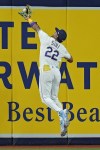 Tampa Bay Rays center fielder Jose Siri (22) makes a leaping catch on a flout by Oakland Athletics' Seth Brown during the eighth inning of a baseball game Friday, April 7, 2023, in St. Petersburg, Fla. (AP Photo/Chris O'Meara)