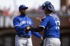 Kansas City Royals catcher Salvador Perez, right, congratulates pitcher Aroldis Chapman after the final out of their victory over the San Francisco Giants in a baseball game, Saturday, April 8, 2023, in San Francisco. (AP Photo/D. Ross Cameron)