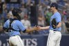 Tampa Bay Rays relief pitcher Kevin Kelly, right, is congratulated by catcher Francisco Mejia (21) after getting the save in a win over the Oakland Athletics in a baseball game, Saturday, April 8, 2023, in St. Petersburg, Fla. (AP Photo/Phelan M. Ebenhack)
