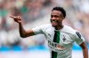 Gladbach's Nathan N'Goumou celebrates after scoring his side's first goal, during the Bundesliga soccer match between Borussia Mönchengladbach and VfL Wolfsburg at the Borussia-Park stadium in Mönchengladbach, Germany, Sunday, April 9, 2023. (Marius Becker/dpa via AP)