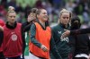 FILE - Republic of Ireland's Sinead Farrelly, center, greets players after the team's match with the United States in an international friendly soccer match in Austin, Texas, Saturday, April 8, 2023. Farrelly says she wouldn't have been able to play soccer again if she hadn't told her story. In 2021, Farrelly and teammate Mana Shim accused former National Women's Soccer League coach Paul Riley of misconduct and sexual coercion in an article published by The Athletic. (AP Photo/Eric Gay, File)