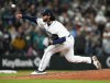 Seattle Mariners relief pitcher Andres Munoz throws to a Cleveland Guardians batter during the ninth inning of an opening day baseball game Thursday, March 30, 2023, in Seattle. The Mariners won 3-0. (AP Photo/Lindsey Wasson)