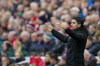 Arsenal's manager Mikel Arteta gives instructions to his players during the English Premier League soccer match between Liverpool and Arsenal at Anfield in Liverpool, England, Sunday, April 9, 2023. (AP Photo/Jon Super)