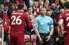 Liverpool's Andrew Robertson appeals to assistant referee Constantine Hatzidakis during the Premier League match between Liverpool and Arsenal at Anfield, Liverpool, Britain, Sunday April 9, 2023. (Nick Potts/PA via AP)