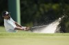 Sahith Theegala hits from the bunker on the 18th hole during the final round of the Masters golf tournament at Augusta National Golf Club on Sunday, April 9, 2023, in Augusta, Ga. (AP Photo/David J. Phillip)