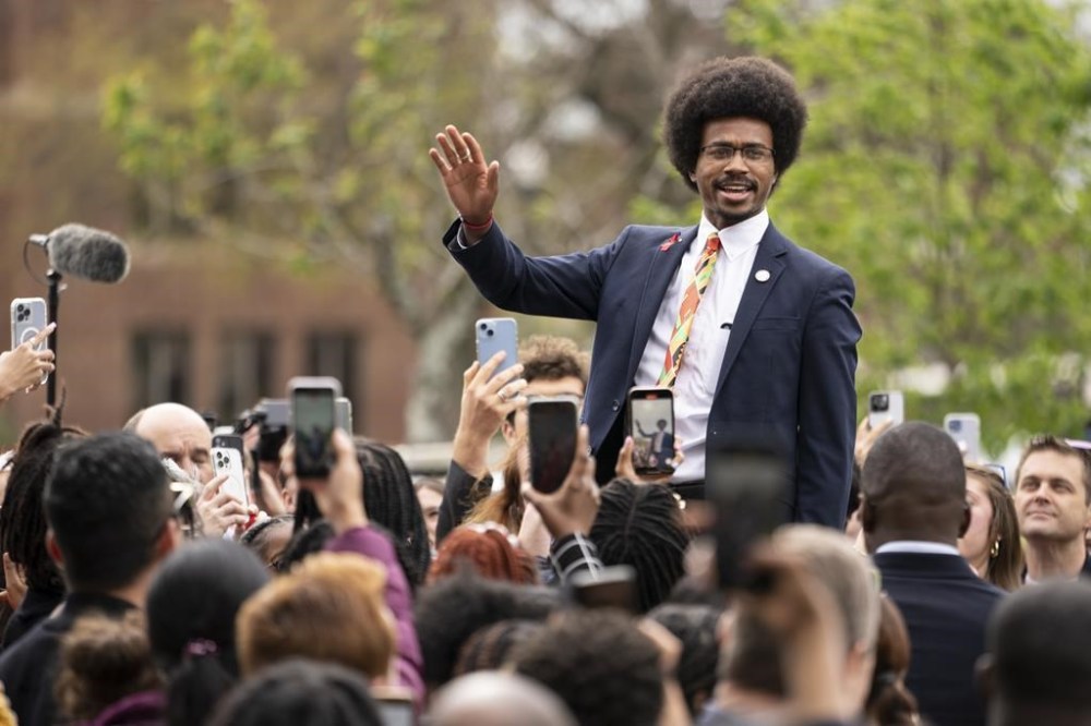 Expelled Rep. Justin Pearson waves, Friday, April 7, 2023, in Nashville, Tenn., the day after Pearson and another member of the Tennessee State Legislature were expelled. (AP Photo/George Walker IV)