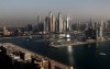 FILE - Luxury towers dominate the skyline in the Marina district, center, and the new Dubai Harbour development, right, are seen from the observation deck of 