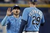 Tampa Bay Rays second baseman Brandon Lowe, left, celebrates with relief pitcher Pete Fairbanks after the team defeated the Boston Red Sox during a baseball game Monday, April 10, 2023, in St. Petersburg, Fla. (AP Photo/Chris O'Meara)