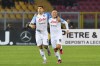 Napoli's Giovanni Di Lorenzo, left, celebrates with teammate Giacomo Raspadori after scoring his side's first goal during the Italian Serie A soccer match between Lecce and Napoli at the Via del Mare Stadium in Lecce, Italy, Friday, April 7, 2023. (Giovanni Evangelista/LaPresse via AP)