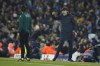 Bayern's head coach Thomas Tuchel, right, complains at the fourth official Jose Luis Munuera during the Champions League quarterfinal, first leg, soccer match between Manchester City and Bayern Munich at the Etihad stadium in Manchester, England, Tuesday, April 11, 2023. (AP Photo/Dave Thompson)