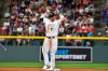 Colorado Rockies designated hitter Mike Moustakas gestures to the dugout after his double in the fifth inning against the St. Louis Cardinals of a baseball game Tuesday, April 11, 2023, in Denver. (AP Photo/John Leyba)