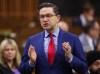 Conservative Leader Pierre Poilievre rises during Question Period in the House of Commons on Parliament Hill in Ottawa on Friday, March 31, 2023. Poilievre sent a letter to Twitter asking the company to tag CBC's various news-related accounts with a 