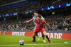 Bayern's Benjamin Pavard, foreground, is challenged by Manchester City's Jack Grealish during the Champions League quarterfinal, first leg, soccer match between Manchester City and Bayern Munich at the Etihad stadium in Manchester, England, Tuesday, April 11, 2023. (AP Photo/Jon Super)