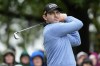 Patrick Cantlay watches his tee shot on the fourth hole during the weather delayed third round of the Masters golf tournament at Augusta National Golf Club on Saturday, April 8, 2023, in Augusta, Ga. (AP Photo/Mark Baker)