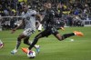 CF Montreal defender Kamal Miller (3) and Nashville SC midfielder Fafa Picault (7) close in on the ball in the first half of an MLS soccer game&nbsp;in Nashville, Tenn., Saturday, March 11, 2023. CF Montreal traded Canadian international Kamal Miller and $1.3 million in General Allocation Money in 2023 to Inter Miami for midfielder Bryce Duke and winger Ariel Lassiter on Wednesday. THE CANADIAN PRESS/AP-Mark Humphrey