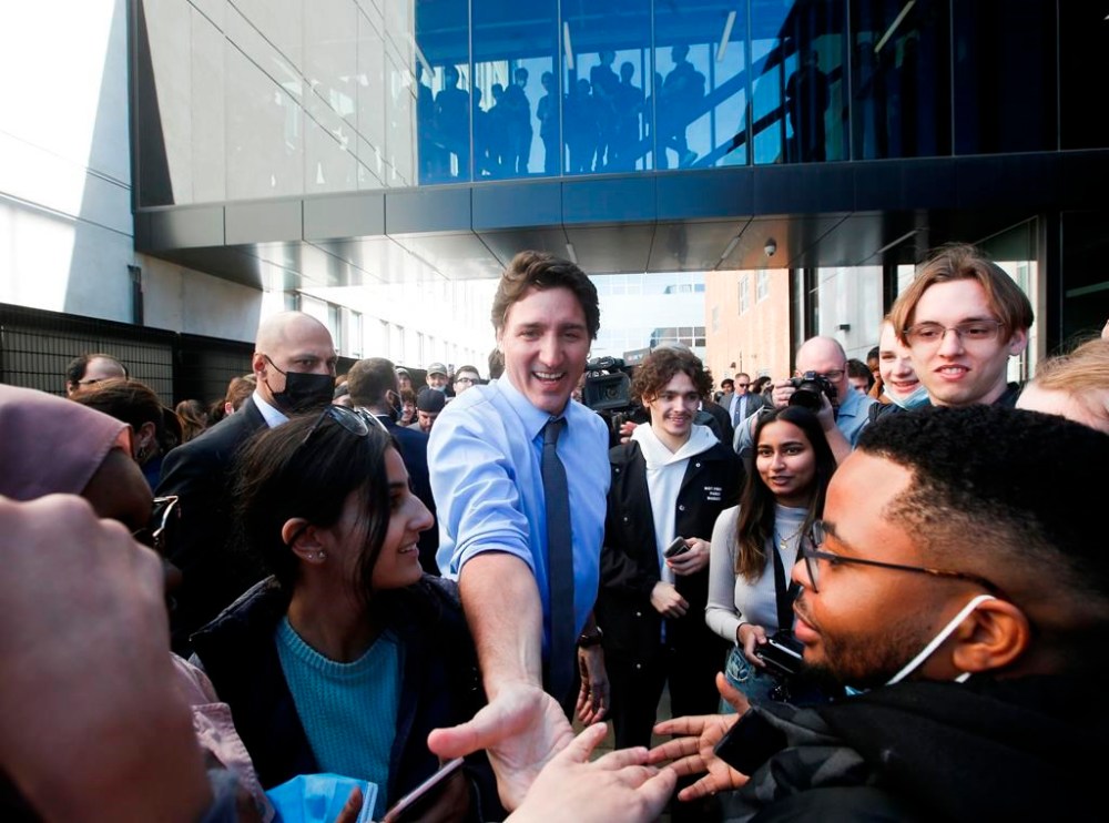 Prime Minister Justin Trudeau greets students outside the University of Manitoba Faculty of Engineering in Winnipeg on Wednesday, April 12, 2023. Trudeau spent the day in the city promoting his government’s new budget. THE CANADIAN PRESS/John Woods
