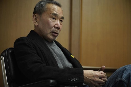 In this photo released by Shinchosha, Haruki Murakami speaks on March 17, 2023 at Shinchosha in Tokyo. Murakami wrote a story of a walled city when he was fresh off his debut. More than four decades later, as a seasoned and acclaimed novelist, he gave it a new life as 