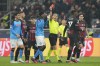 Referee Istvan Kovacs from Romania, center, shows a red card to Napoli's Andre-Frank Zambo Anguissa, center, left, during the Champions League quarterfinal, first leg, soccer match between AC Milan and Napoli, at the San Siro stadium in Milan , Italy, Wednesday, April 12, 2023. (AP Photo/Antonio Calanni)