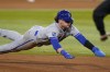 Kansas City Royals' Bobby Witt Jr. dives into third on a steal during the seventh inning of the team's baseball game against the Texas Rangers in Arlington, Texas, Wednesday, April 12, 2023. (AP Photo/LM Otero)