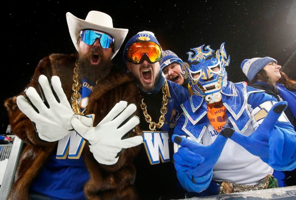Winnipeg Blue Bombers' fans celebrate a win over the BC Lions in the CFL western division final in Winnipeg, Sunday, Nov. 13, 2022. The Winnipeg Blue Bombers just fell short of a third straight Grey Cup title but the 2022 season was a profitable one for the community-owned franchise. THE CANADIAN PRESS/John Woods
