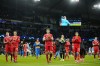 Bayern Munich players applaud fans at the end of the Champions League quarterfinal, first leg, soccer match between Manchester City and Bayern Munich at the Etihad stadium in Manchester, England, Tuesday, April 11, 2023. Manchester City won 3-0. (AP Photo/Jon Super)