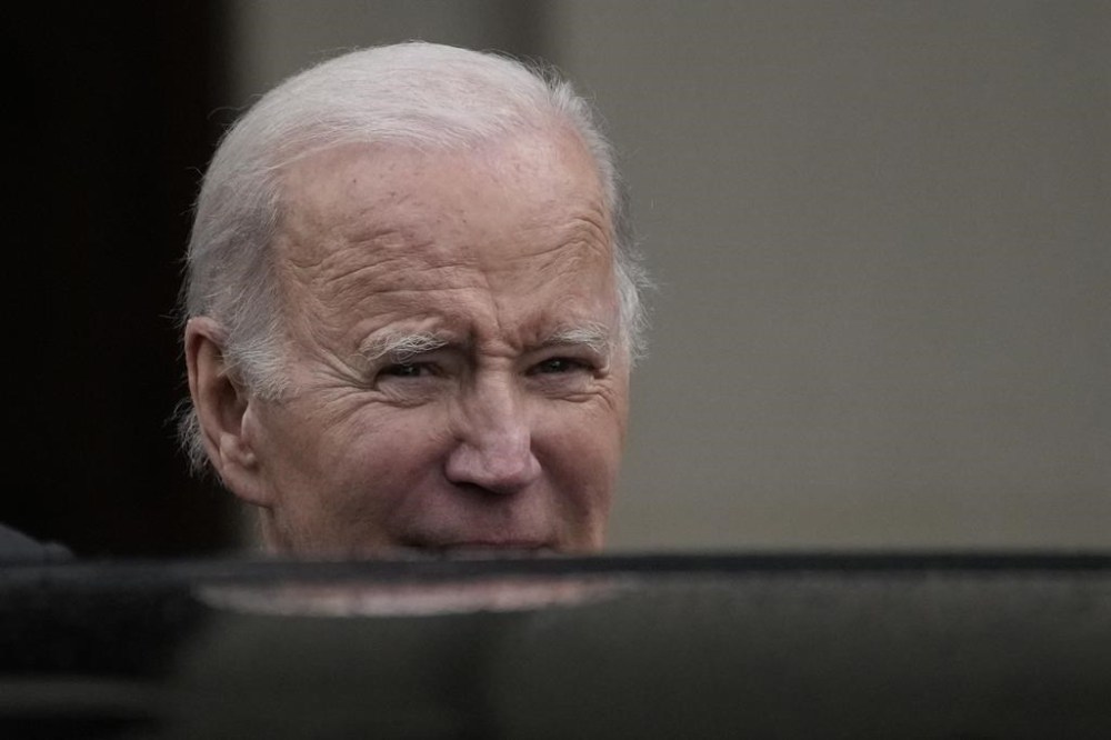President Joe Biden look sat the media as President departs from Farmleigh House after a visit with Ireland's Taoiseach Leo Varadkar, in Dublin, Ireland, Thursday, April 13, 2023. (AP Photo/Christophe Ena)