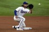 Texas Rangers' Josh Smith reaches out for a throw to second during the team's baseball game against the Kansas City Royals, Tuesday, April 11, 2023, in Arlington, Texas. The Rangers are looking at a month, maybe more, without star shortstop Corey Seager because of a hamstring strain. Manager Bruce Bochy is comfortable with the options, starting with Smith. (AP Photo/Tony Gutierrez)