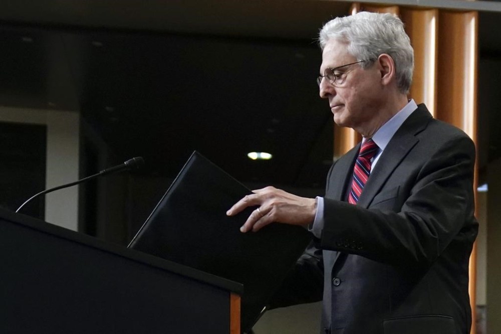 Attorney General Merrick Garland arrives to speak at the Department of Justice in Washington, Thursday, April 13, 2023. Garland announced that a Massachusetts Air National Guard member who has emerged as a main person of interest in the disclosure of highly classified military documents on the Ukraine war was taken into custody Thursday by federal agents. (AP Photo/Evan Vucci)