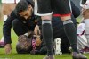 Roma's Tammy Abraham reacts after sustaining an injury during the first leg quarterfinal soccer match between Feyenoord and Roma at De Kuip stadium in Rotterdam, Netherlands, Thursday, April 13, 2023. (AP Photo/Peter Dejong)