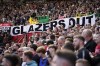 A banner writing ' Glazers out' is displayed by spectators during the English Premier League soccer match between Manchester United and Everton, at the Old Trafford stadium in Manchester, England, Saturday, April 8, 2023. (AP Photo/Dave Thompson)