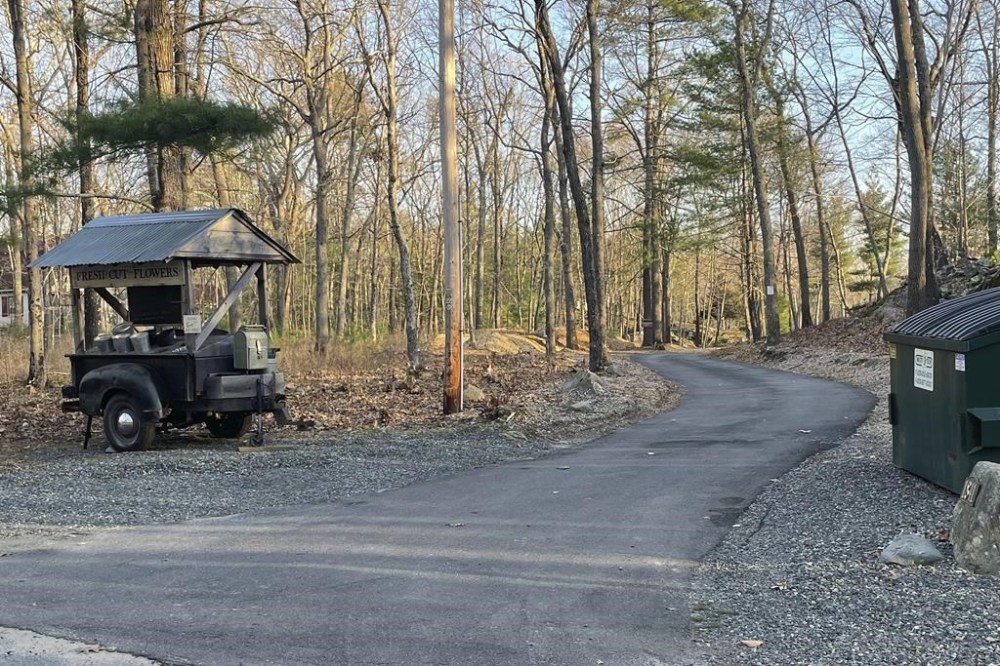 The driveway where Jack Teixeira, a Massachusetts Air National Guard member, was taken into custody is shown in Dighton, Mass., Thursday, April 13, 2023. Teixeira, 21, was arrested Thursday in connection with the disclosure of highly classified military documents about the Ukraine war and other top national security issues. (AP Photo/Jennifer McDermott)