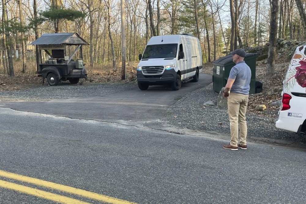 Federal officials leave the property where Jack Teixeira, a Massachusetts Air National Guard member, was taken into custody in Dighton, Mass., Thursday, April 13, 2023. Teixeira, 21, was arrested Thursday in connection with the disclosure of highly classified military documents about the Ukraine war and other top national security issues. (AP Photo/Jennifer McDermott)