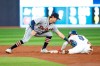 Toronto Blue Jays' Cavan Biggio (8) steals second base ahead of the tag from Detroit Tigers' Zach McKinstry (39) in third inning MLB American League baseball action in Toronto on Thursday, April 13, 2023. THE CANADIAN PRESS/Cole Burston