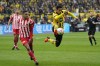 Union's Danilho Doekhi, left, watches as Dortmund's Jude Bellingham tries to control the ball during the German Bundesliga soccer match between Borussia Dortmund and Union Berlin in Dortmund, Germany, Saturday, April 8, 2023. (AP Photo/Martin Meissner)