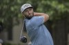 Jon Rahm, of Spain, watches his drive down the 12th fairway during the first round of the RBC Heritage golf tournament, Thursday, April 13, 2023, in Hilton Head Island, S.C. (AP Photo/Stephen B. Morton)