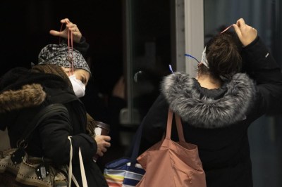 Health-care workers discard their masks at the end of their shift at the Bluewater Health Hospital in Sarnia, Ont., on Wednesday, January 26, 2022. Masking inside several hospitals in southwestern Ontario will no longer be mandatory in high risk areas for physicians, patients, staff and all other visitors starting next week. THE CANADIAN PRESS/Chris Young