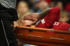 Manchester United's Lisandro Martinez is carried on stretcher after suffering an injury during the Europa League first leg quarterfinal soccer match between Manchester United and Sevilla at the Old Trafford stadium in Manchester, Thursday, April 13, 2023. (AP Photo/Dave Thompson)