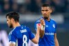 Schalke's Danny Latza, left, high-fives with Schalke's Moritz Jenz during the Bundesliga soccer match between FC Schalke 04 and Hertha BSC, at Veltins Arena in Gelsenkirchen, Germany, Friday April 14, 2023. (David Inderlied/dpa via AP)