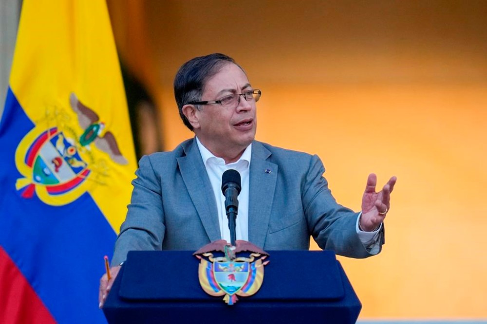 FILE - Colombian President Gustavo Petro speaks to supporters before presenting to Congress a proposed bill to reform the healthcare system, outside the Nariño presidential palace in Bogota, Colombia, Monday, Feb. 13, 2023. President Joe Biden is hosting Colombian President Gustavo Petro at the White House for talks next week. (AP Photo/Fernando Vergara, File)