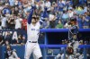 Toronto Blue Jays' George Springer (4) celebrates after hitting a solo home run during first inning MLB baseball action against the Tampa Bay Rays in Toronto on Friday, April 14, 2023. THE CANADIAN PRESS/Christopher Katsarov