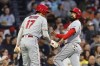 Los Angeles Angels' Anthony Rendon and Shohei Ohtani (17) celebrate after scoring on a double by Hunter Renfroe during the first inning of the team's baseball game against the Boston Red Sox, Friday, April 14, 2023, in Boston. (AP Photo/Michael Dwyer)