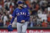 Texas Rangers starting pitcher Martin Perez walks near the mound after giving up a solo home run to Houston Astros' Yordan Alvarez during the third inning of a baseball game Friday, April 14, 2023, in Houston. (AP Photo/Kevin M. Cox)