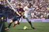 Bologna's Michel Aebischer competes for the ball with AC Milan's Fode Ballo Toure, right, during the Serie A soccer match between Bologna and AC Milan, at the Renato Dall'Ara Stadium in Bologna, Italy, Saturday, April 15, 2023. (Massimo Paolone/LaPresse via AP)