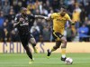 Brentford's Ivan Toney, left, and Wolverhampton Wanderers' Mario Lemina battle for the ballduring the English Premier League match between Wolverhampton Wanderers and Brentford, at Molineux Stadium, Wolverhampton, England, Saturday April 15, 2023. (Barrington Coombs/PA via AP)