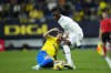 Real Madrid's Eduardo Camavinga, right, and Cadiz's Ivan Alejo challenge for the ball during the Spanish La Liga soccer match between Cadiz CF and Real Madrid at the Nuevo Mirandilla stadium in Cadiz, Spain, Saturday, April 15, 2023. (AP Photo/Jose Breton)