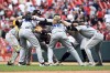 Pittsburgh Pirates players celebrate defeating the St. Louis Cardinals in a baseball game Saturday, April 15, 2023, in St. Louis. (AP Photo/Jeff Le)